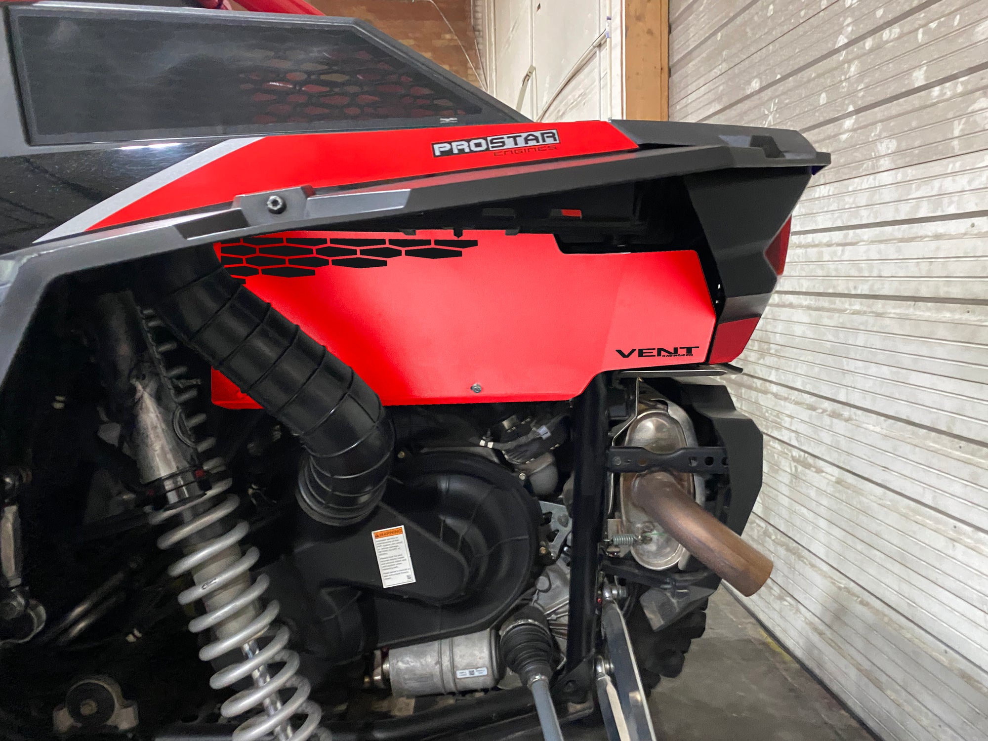 Red bed side cover on a 2017 RZR Turbo.